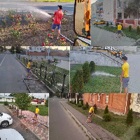 Проводится полив клумб на территории города